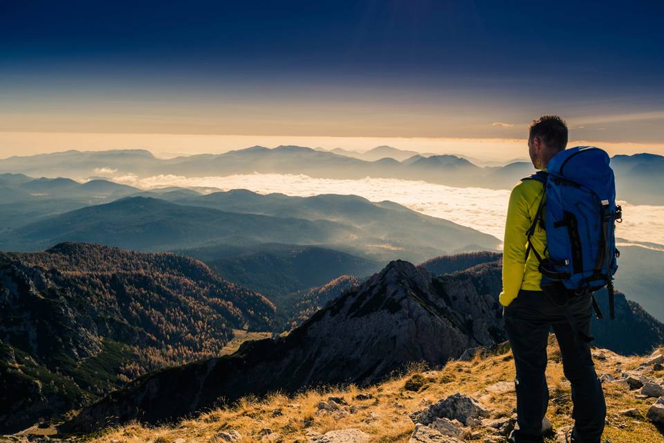 Man standing on top of a mountain