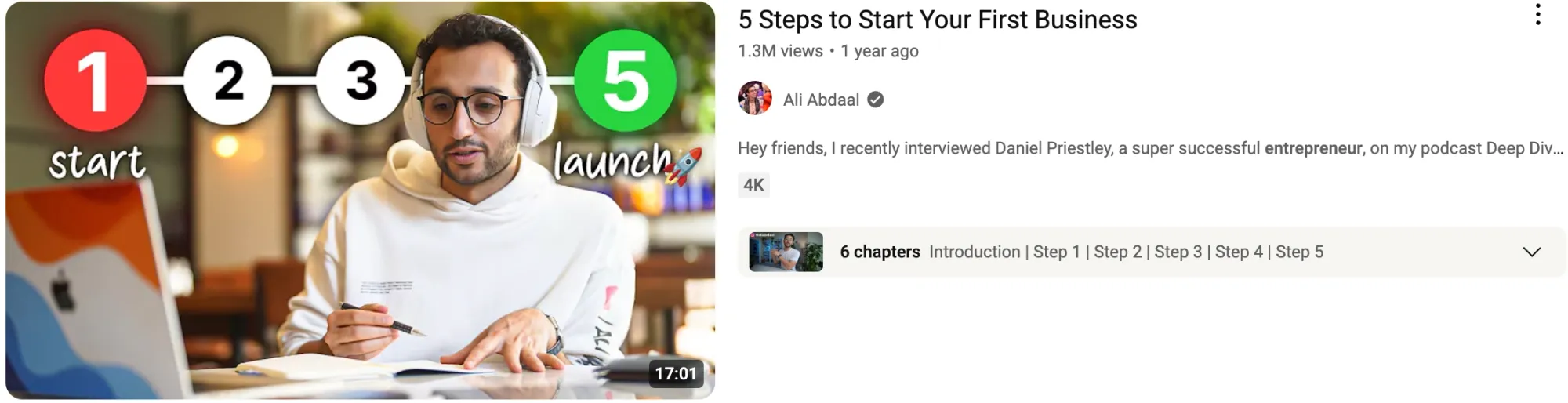 A man at a desk works on a business plan for a video titled “5 Steps to Start Your First Business.”