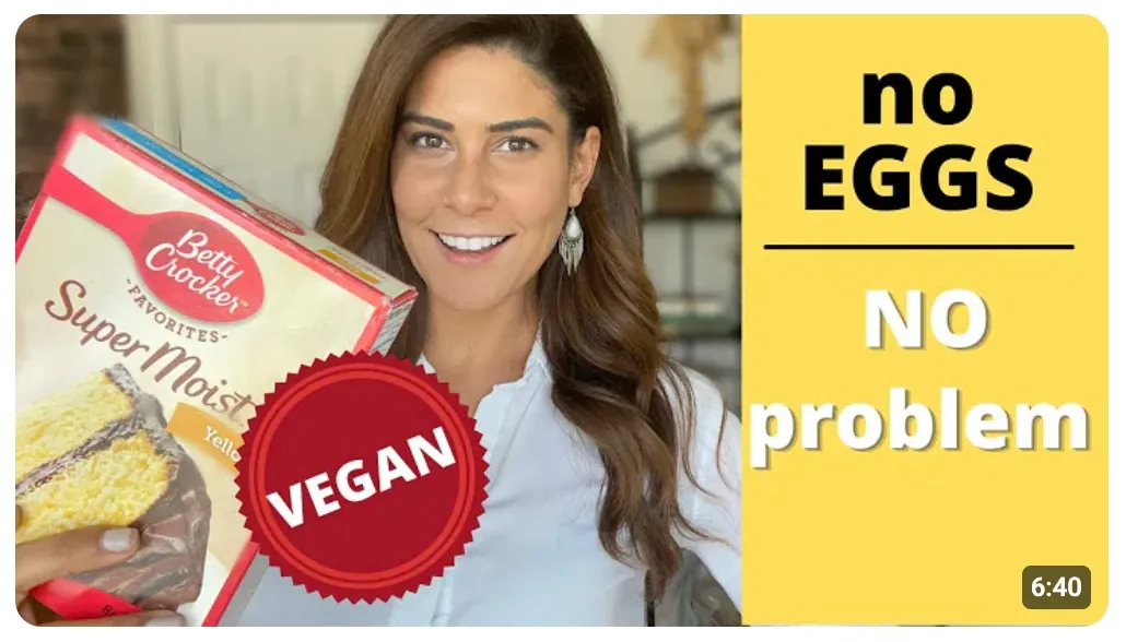 YouTube thumbnail featuring a woman holding a box of Betty Crocker cake mix with the label 'Vegan.' The text reads 'No Eggs, No Problem,' highlighting an egg-free vegan baking solution